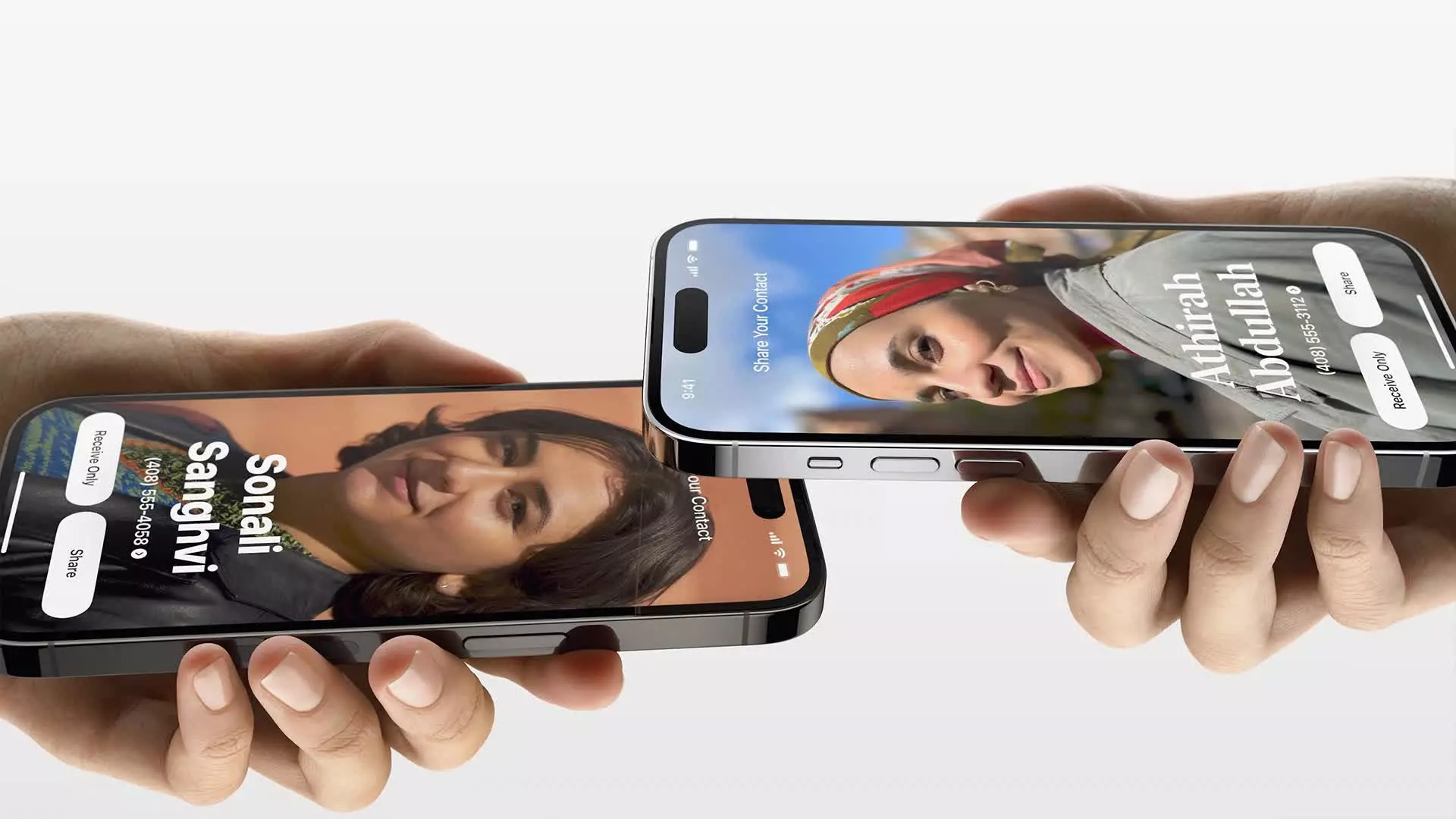A pair of hands holding two iPhones displaying a woman's face, showcasing Apple's presentation at WWDC 2023.